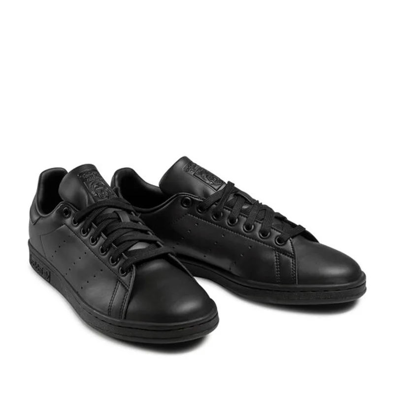 Stan smith best sale negras y doradas
