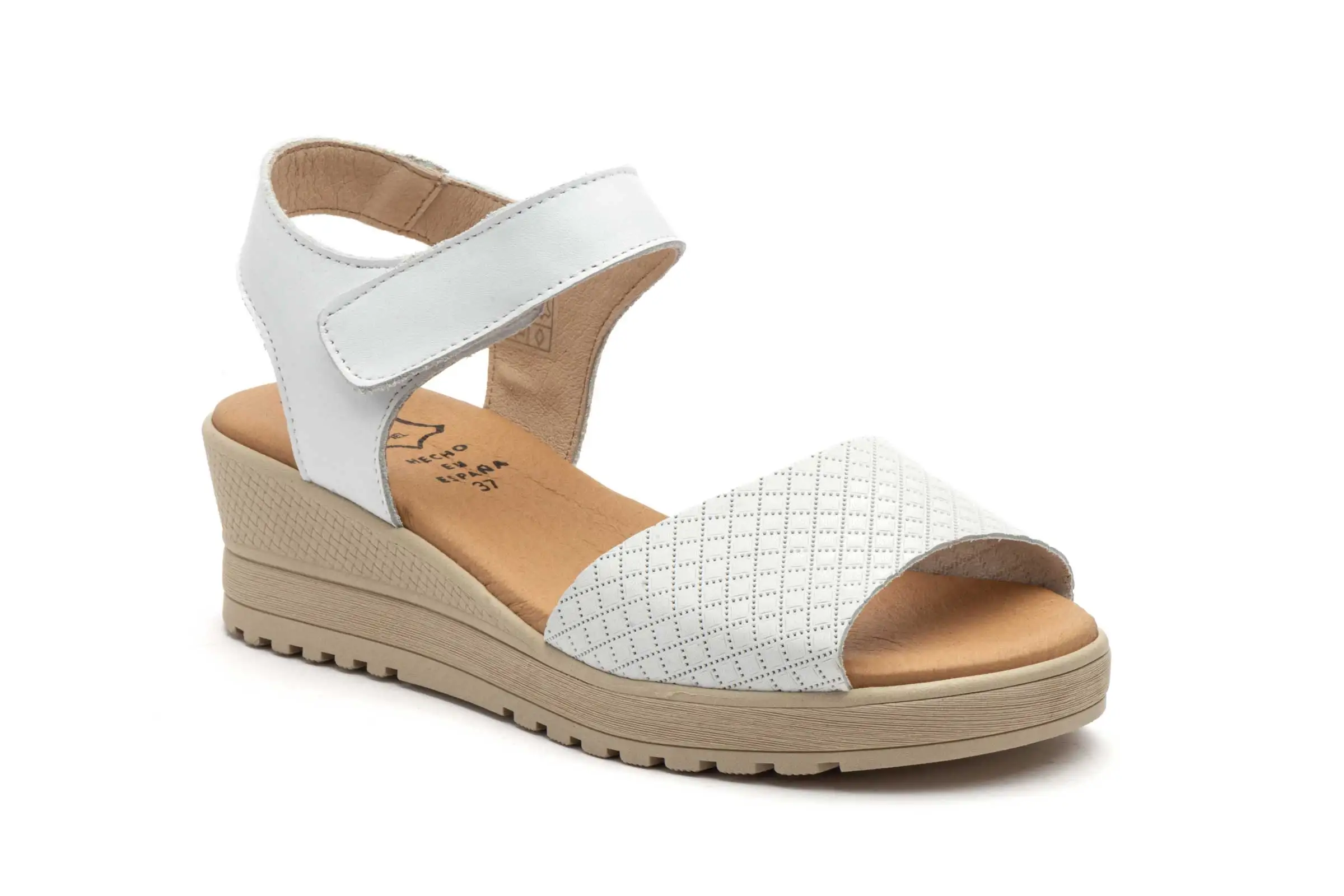 Black wedge sandals on foot