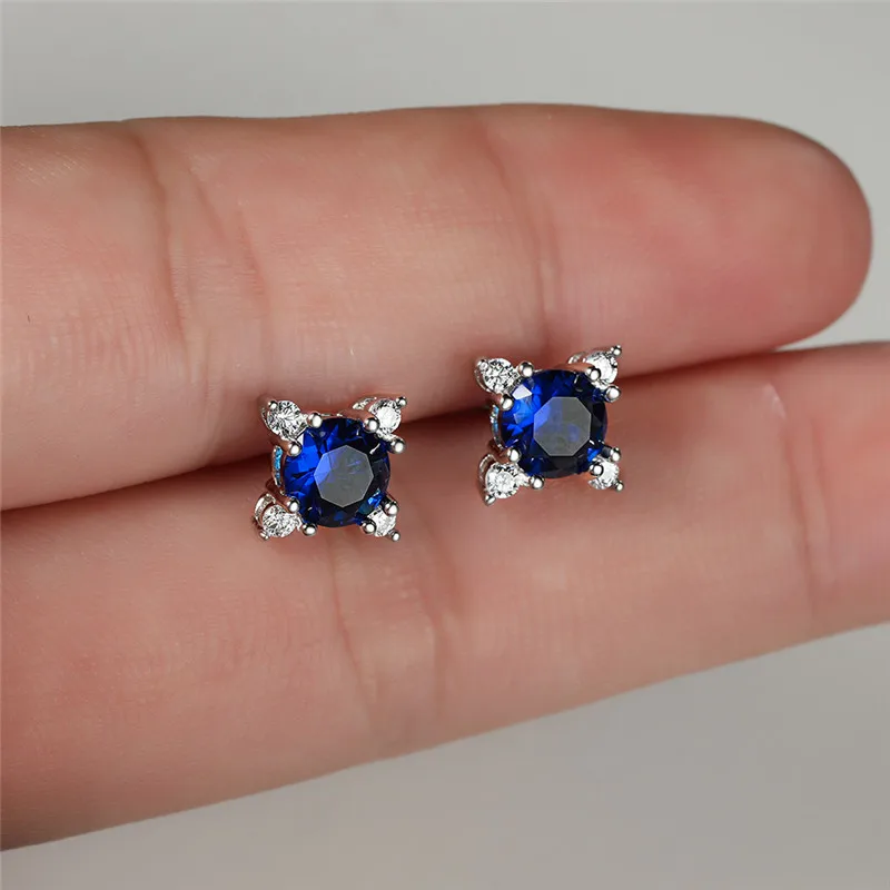 Infinity Blue Topaz Platinum plated Silver Stud Earrings | Jian London