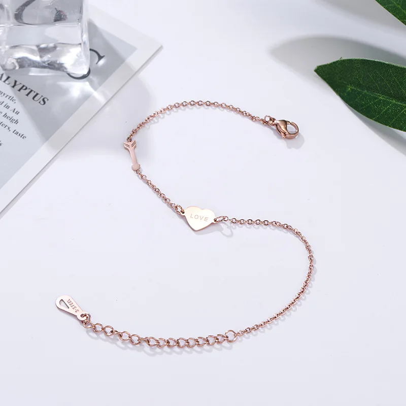 

JeeMango New Cupid Arrow Love Heart Anklet Female Rose Gold Titanium Steel Anklet Jewelry For Girls RN03120