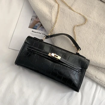 

A small square bag with croc chain on one shoulder bag