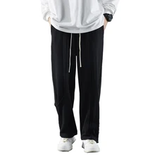 

Spring and autumn casual men's pants stitching solid color cotton trousers loose leggings sweatpants