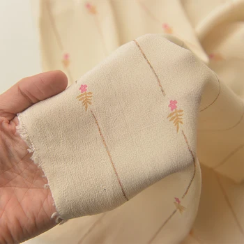 

Rose gold florets light apricot powder viscose rayon fabric