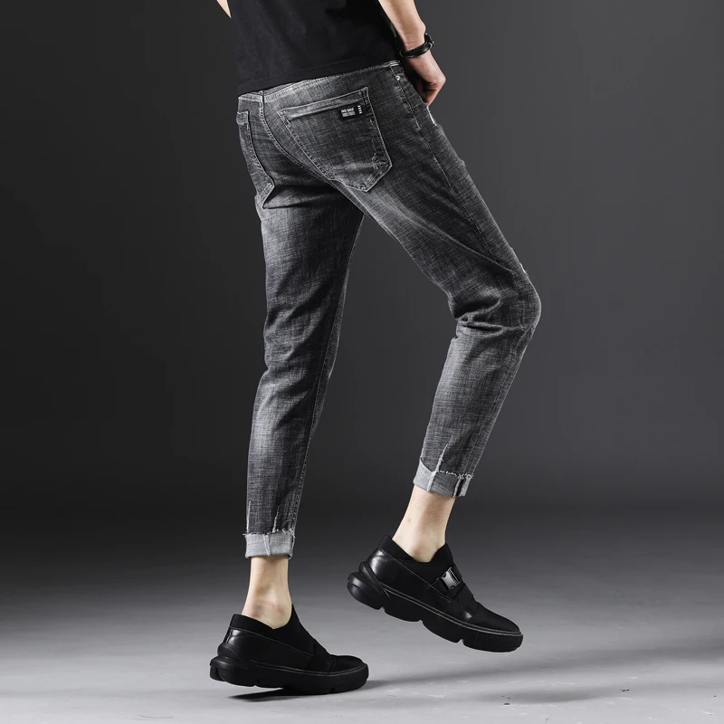 Seller 2020 spring and summer Washed denim plus size men's ripped jeans men's loose frayed nine-point pants Black light-colored harem