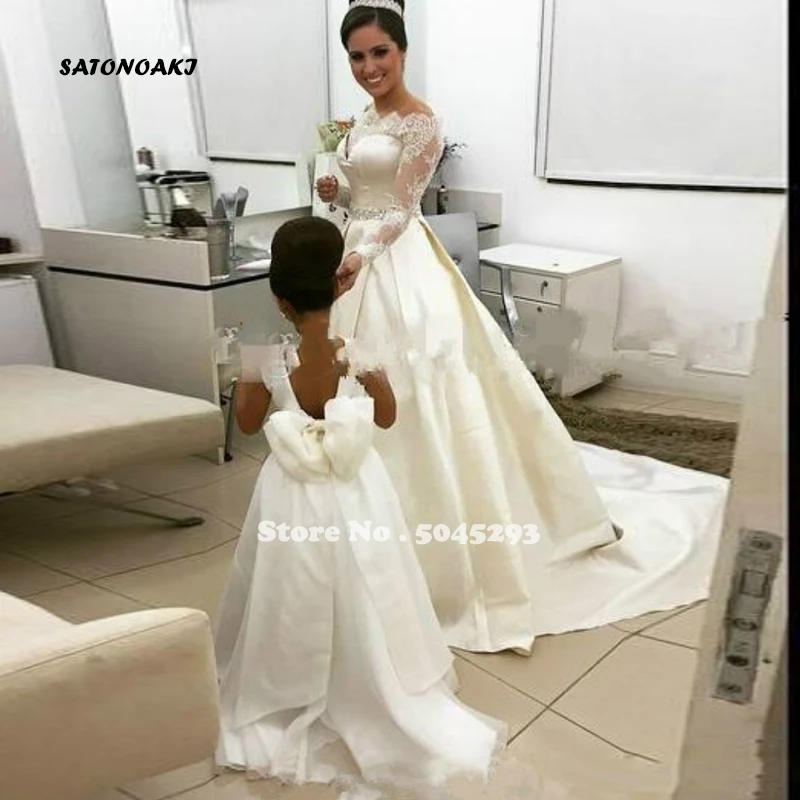 

Ivory A Line Wedding Dresses Lace Beaded Off The Shoulder Sheer Long Sleeves Bridal Gowns Back Covered Buttons Satin Sweep Train
