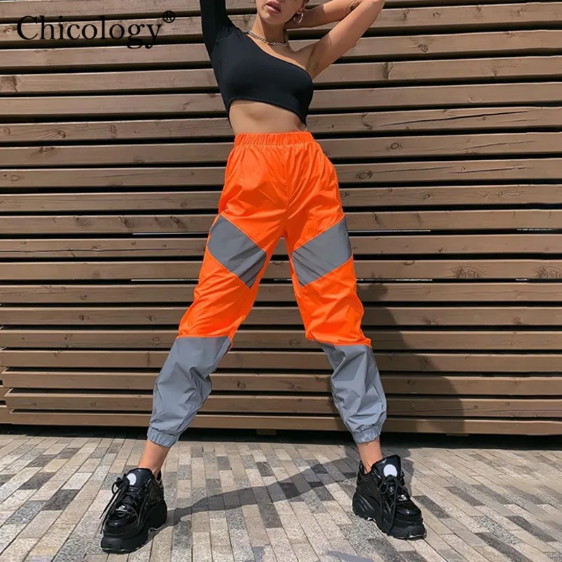 Ceny Chicology flash odblaskowe patchworkowe długie spodnie z wysokim stanem damskie streetwear spodnie 2019 jesienne zimowe damskie klubowe ubrania imprezowe