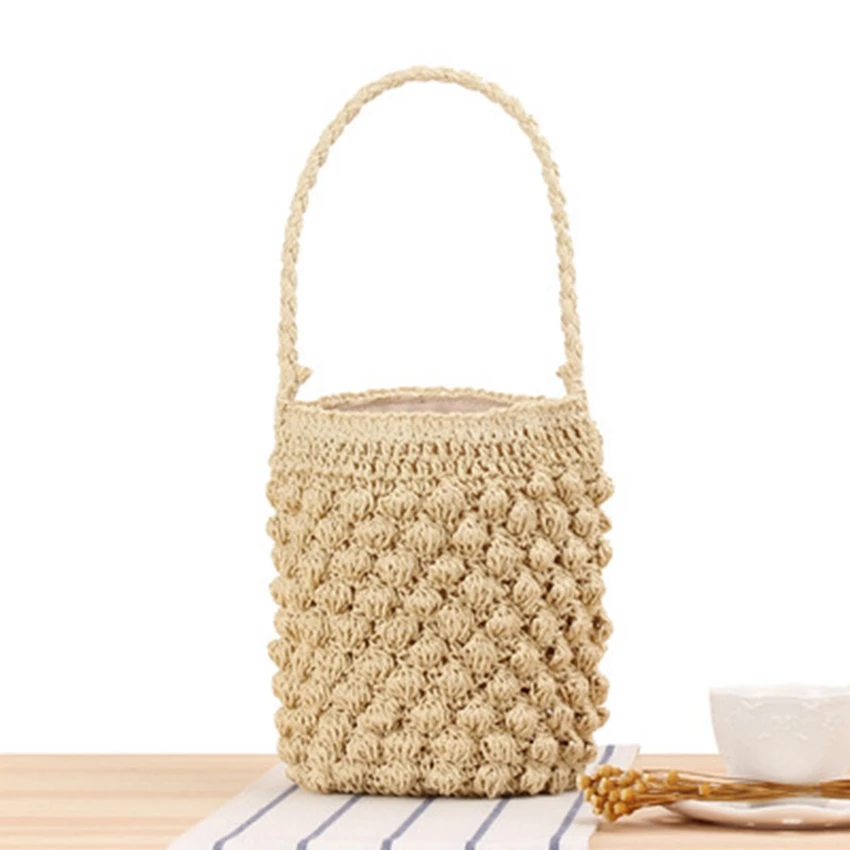 

New cylinder hand-carrying woven bag Japan and South Korea cute bucket straw bag seaside vacation leisure bag