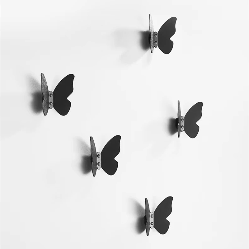 https://ae01.alicdn.com/kf/H04bb9a7e826540fea5dda91d262366e8k/Butterfly-Hooks-Matte-Black-Aluminum-Hardware-Racks-Kitchen-Creative-Hooks-Wall-Mounted-Bathroom-Accessories-Towel-Single.jpg