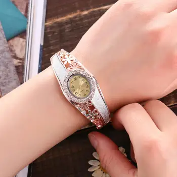 

Luxury Women Rhinestone Hollow Flower Band Oval Dial Analog Quartz Bangle Watch Reloj de mujer Fold-over Clasp Hollow Flower Ban