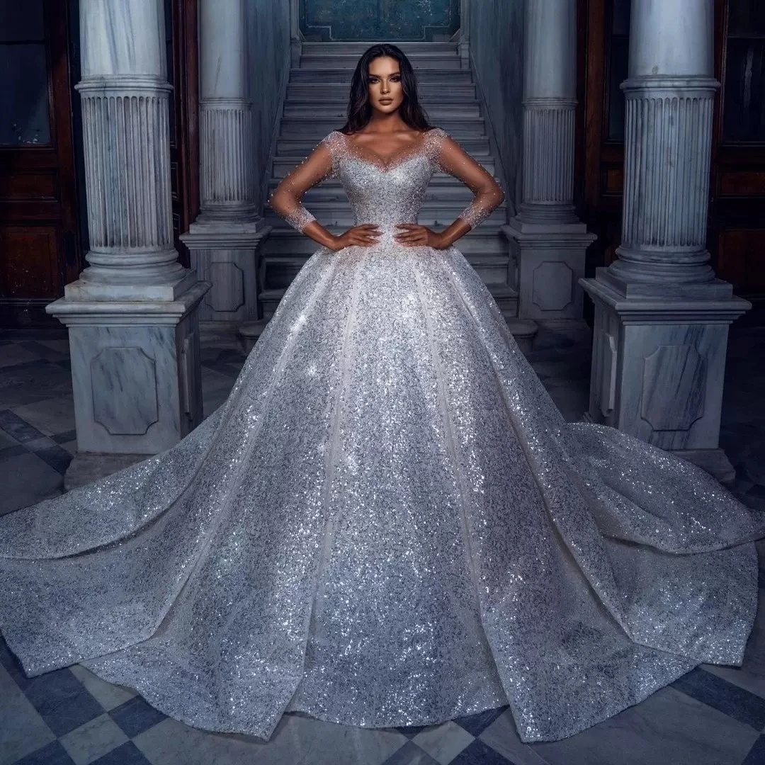 

2022 Sparkly Wedding Dresses Sheer Long Sleeve Beading Bridal Gowns Luxurious Sequined Arabic Dubai Vestido De Novia
