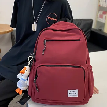 

DCIMOR Waterproof nylon Women Backpack Female Solid color Schoolbag for Teenage girls large capacity Travel backpack Mochilas