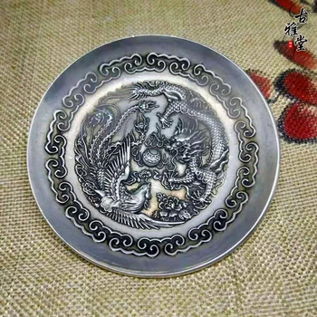 

Ancient-fashioned small ornaments made of old silver bronze (dragon and phoenix) delicate tea saucers