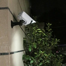 

LED IP65 Waterproof Solar Lamp Wireless Motion Sensor Security Light Creative Dummy Camera Flood Lighting Home Garden Decoration