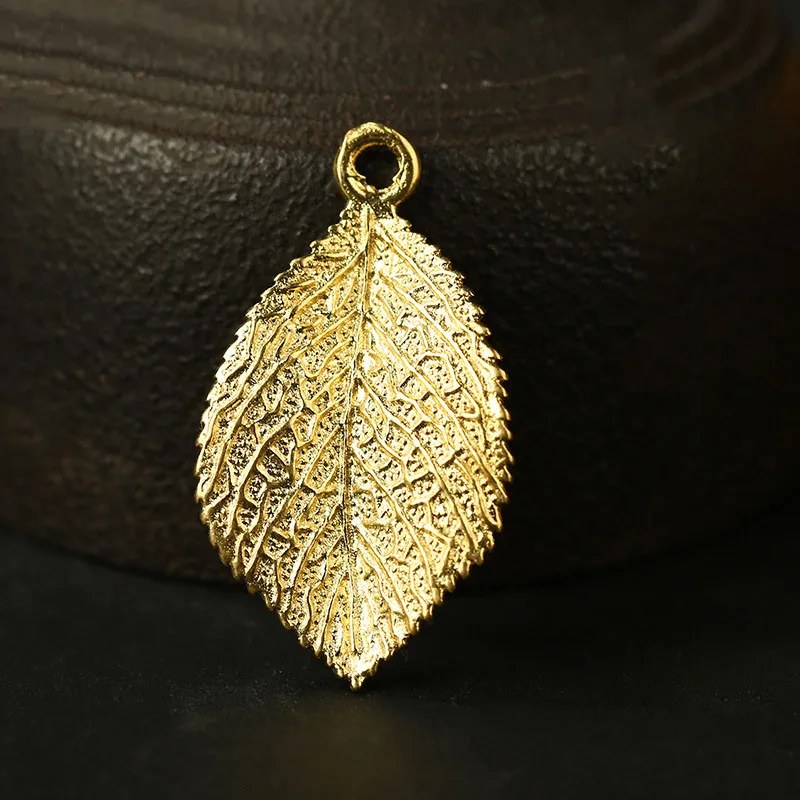 gold leaf charms (2)