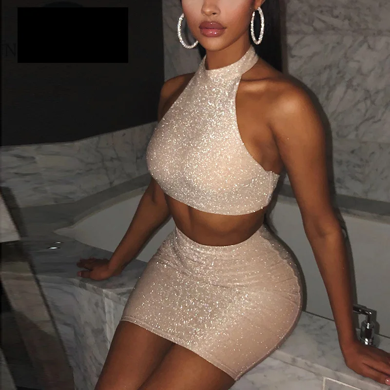 

OMILKA Glitter 2 Piece Women Set Halter Backless Crop Top and Mini Pencil Set 2020 Summer Hollow Out Club Party Shiny Outfits