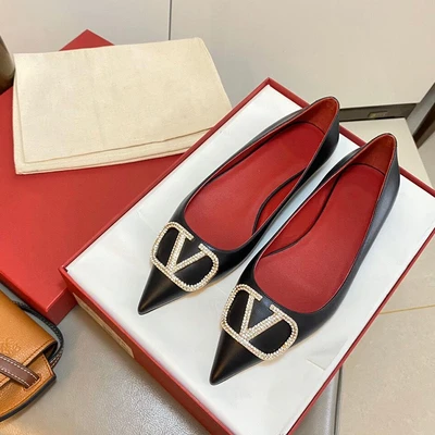 black flat shoes with gold buckle