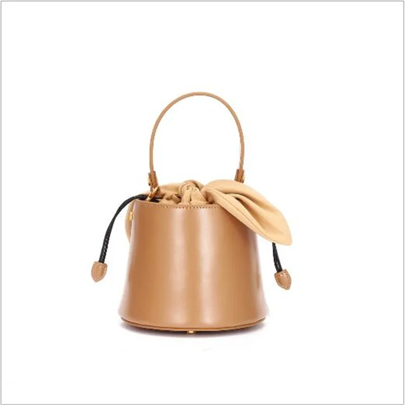 Echt Lederen Tassen Voor Vrouwen 2019 Nieuwe Luxe Designer Boog Handtassen Schouder Crossbody Tas Retro String Emmer Zak Echt Lederen Tassen Voor Vrouwen 2019 Nieuwe Luxe Designer Boog Handtassen Schouder Crossbody Tas Retro String Emmer Zak