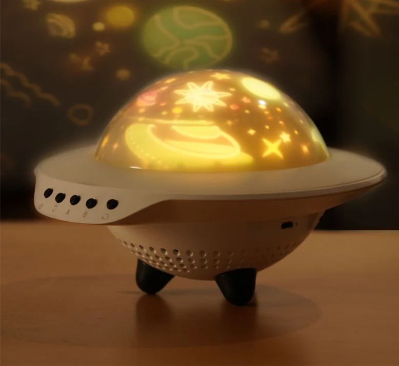 

UFO UFO projection music bluetooth audio remote control rotating projector card creative night light