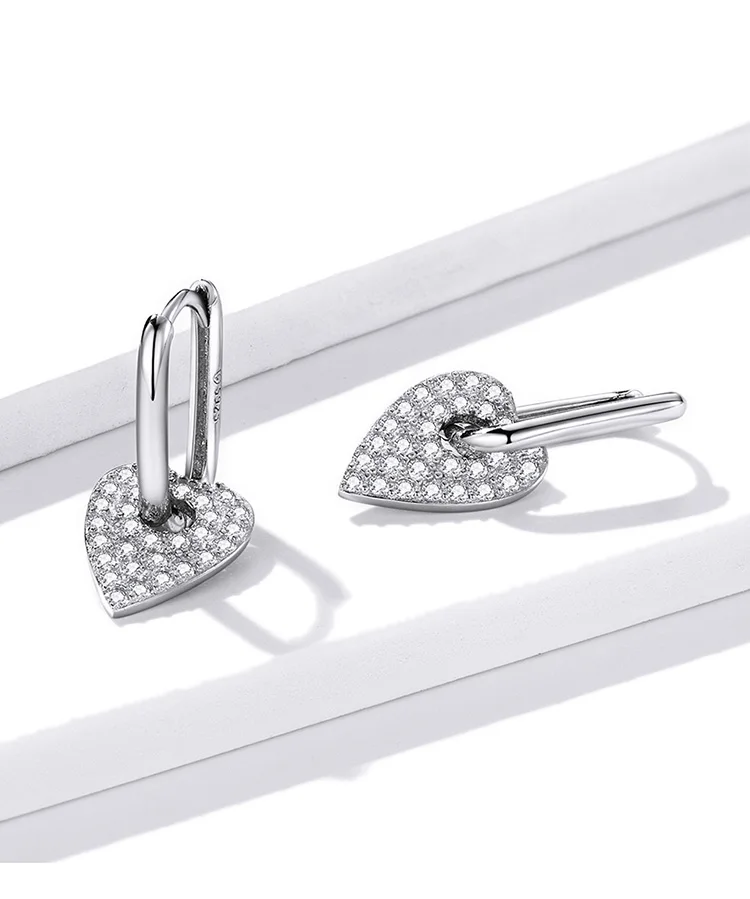 Heart Rectangle Hoop Earrings | S925 Sterling Silver | Go Glam Girl 9 Heart Rectangle Hoop Earrings | S925 Sterling Silver | Go Glam Girl - Show your style with the delicate Heart Rectangle Hoop Earrings. Hand-finished in sterling silver, every hoop earring has a heart dangling on it and encrusted with small sparkling zircons. These dreamy earrings, full of a romantic atmosphere will bring mood and beauty to your day. Perfect gift for mom, sister, grandmother, friend or yourself. | 🚚 Free Standard Shipping 7-30 days | 🥇 Top Quality Product | 💎 100% S925 Sterling Silver | 🛡️ 100% Safe & Secure checkout