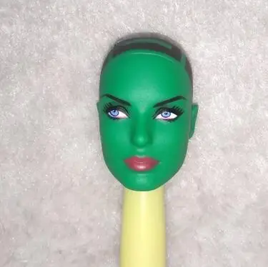 green-doll-head