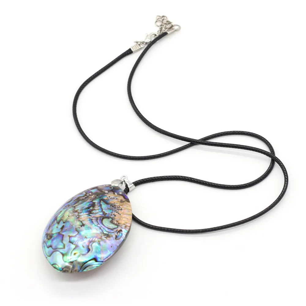 An Abalone Shell Domed Oval Pendant With A Patterned Silvered Metal Top On  A Chain Links Necklace