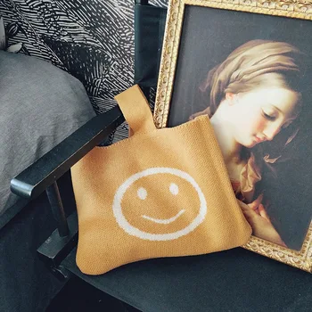 

Korean version of the spring version of the new smiley hand shoulder bag Japanese students solid color wool knitted handbag