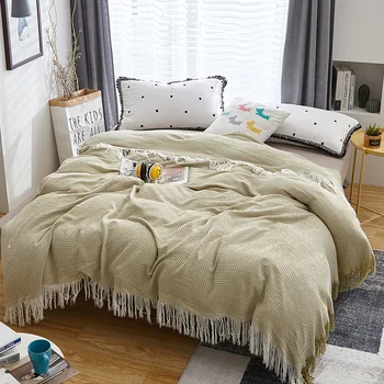 

Cotton and bamboo fiber honeycomb blanket tassel type 150 * 200 summer air conditioning is covered by sofa blanket