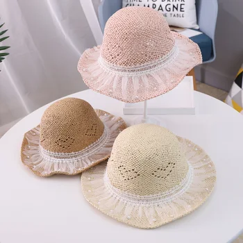 

Baby girl princess hats Hand-beaded children's straw hat Korean 2020 summer new travel sun protection big along boy beach hat