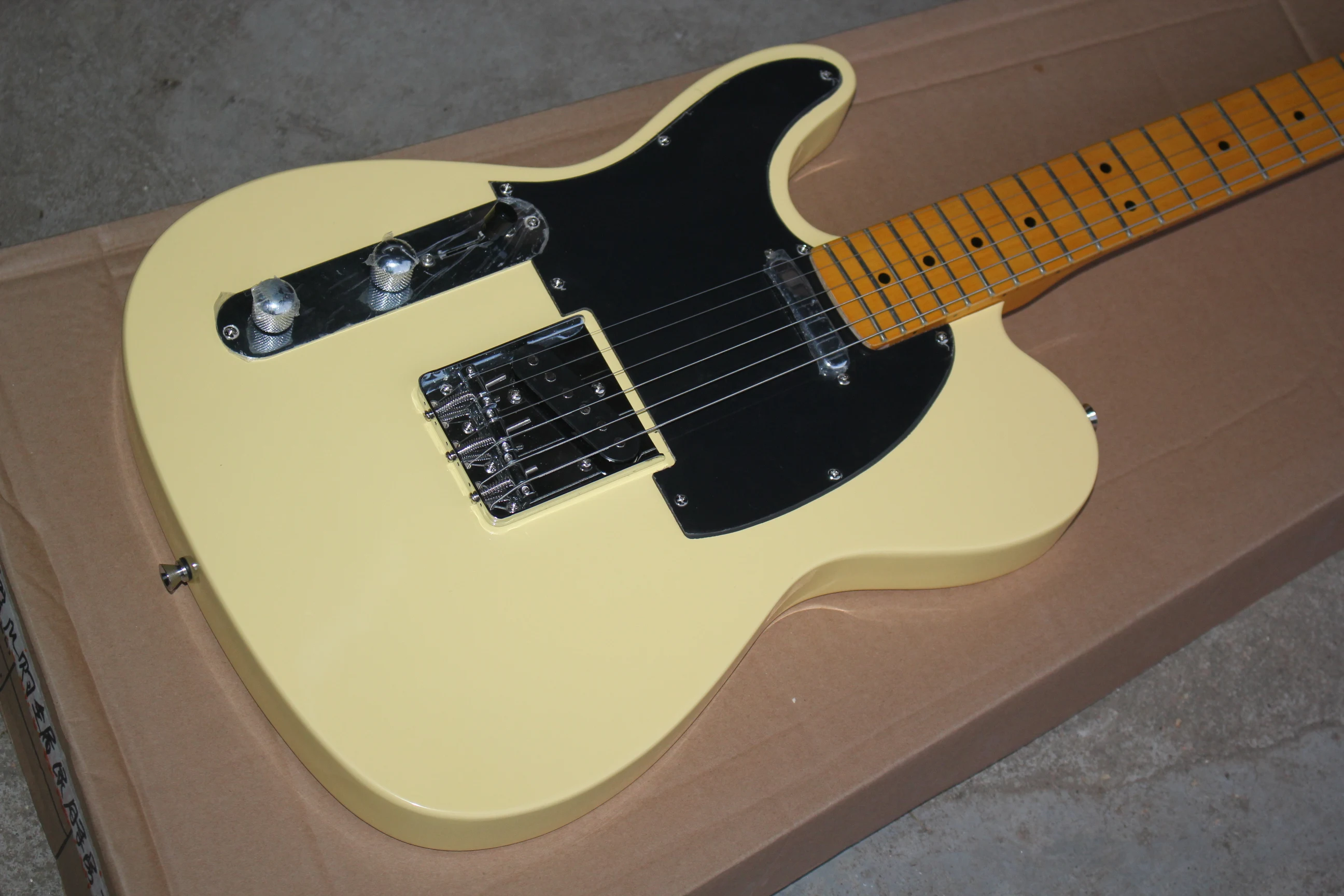 

Left hand TL guitar cream yellow version black pickguard high quality free shipping