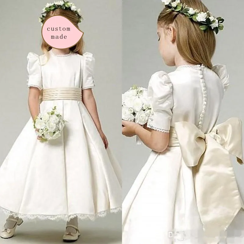 

Ivory Satin Flower Girl Dresses With Champagne Bow Sash Jewel Neck Ankle Length Bubble Short Sleeves Lace Hemline Girls Dresses