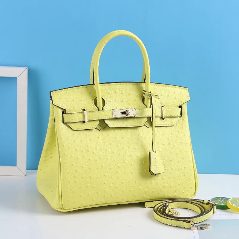 

Fashion leather pure color temperament single shoulder oblique span hand-held lady bag