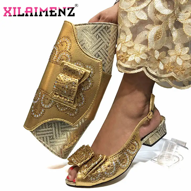 gold sandals and matching bag
