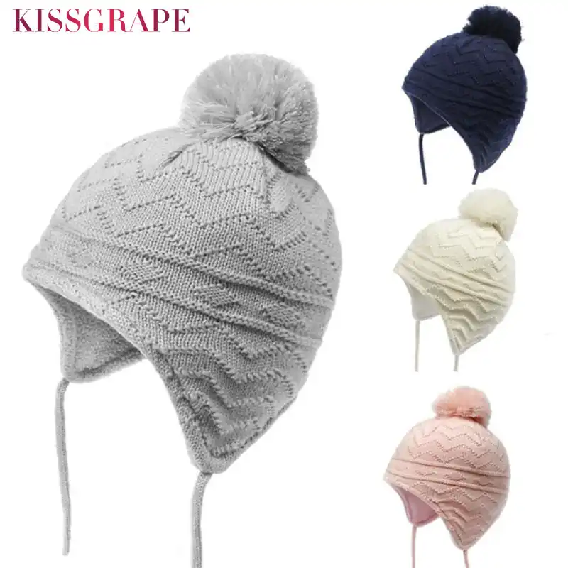 white knit hat with ear flaps