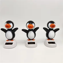 Солнечный креативный качели Apple как цветок Пингвин вращающийся кукла автомобиль украшения, украшенные изображениями из мультфильмов детское Подарочное платье с О-образным воротником, игрушка