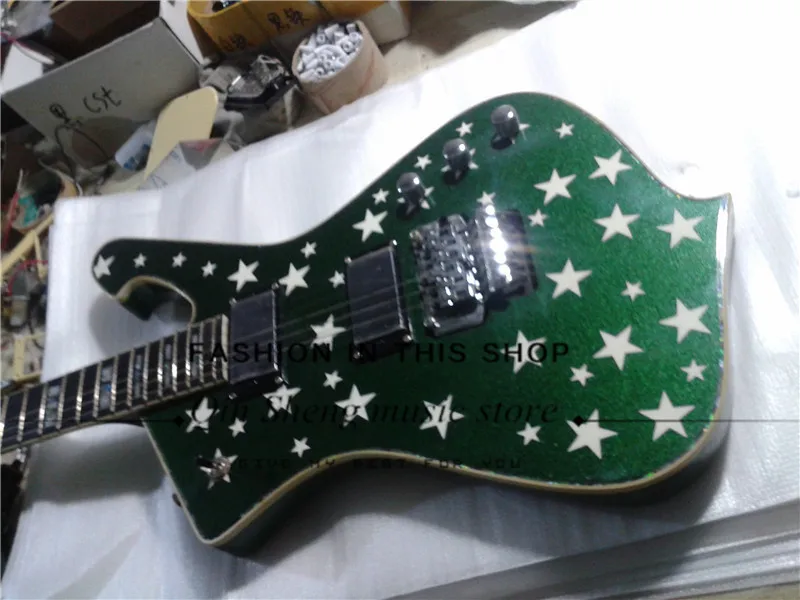 

free shipping green electric guitar with irregular body,stars pattern,maple neck,rosewood fretboard with shell inlay