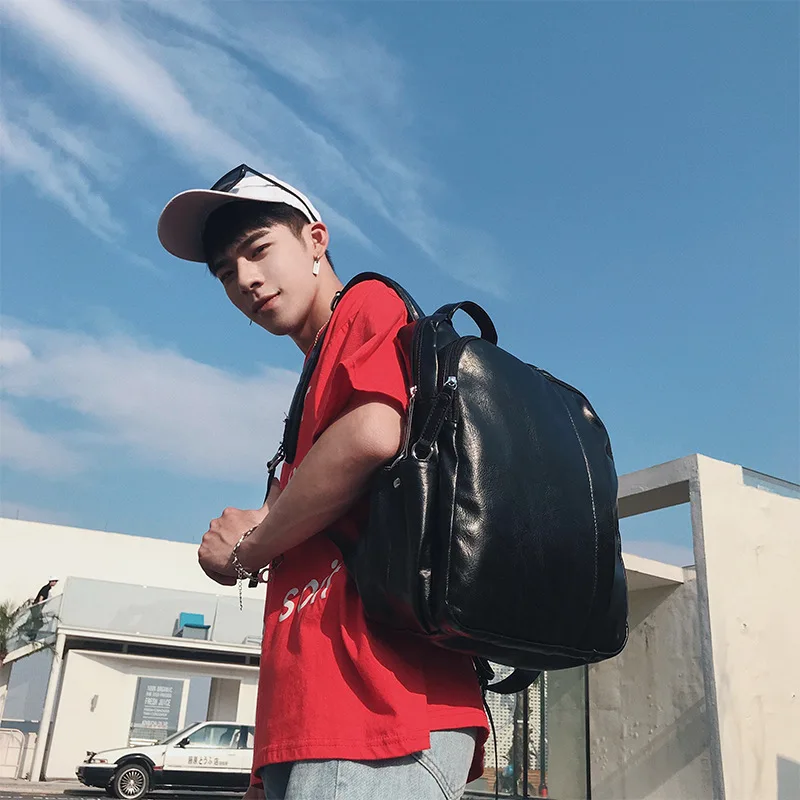 

Trendy PU double shoulder version male Korean version fashion backpack student schoolbag male PU leather travel bag trendy male