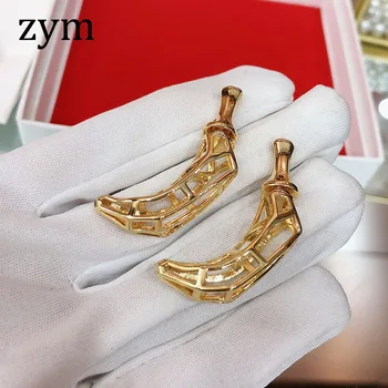 

zym2019Hot brand gold banana earrings high-quality European and American hollow earrings fashion dance women's luxury earrings