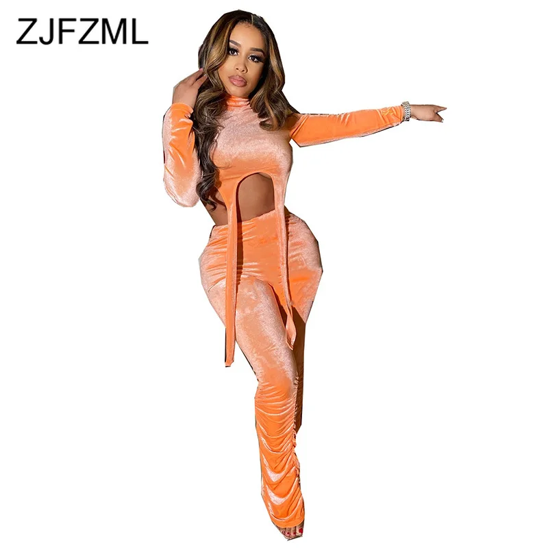orange velour tracksuit