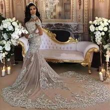 Dubaj arabski luksusowy świecący 2020 suknie ślubne Sexy Bling koronki z kryształkami aplikacja na szyję Illusion długie rękawy sukienka syrenka