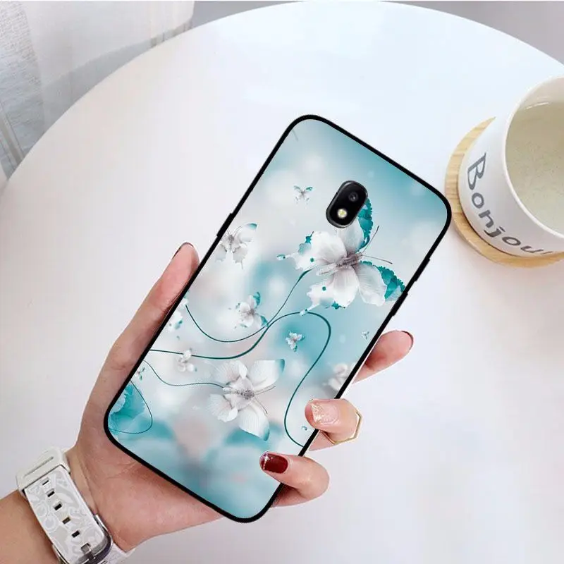 Red butterfly on white roses flower