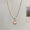 Изображение товара https://ae01.alicdn.com/kf/H0c7dc0b593e949c488be857b4c917004Z/MENGJIQIAO-Korean-Elegant-Pearl-Beads-Necklace-For-Women-Ladies-Fashion-Rhinestone-Shell-Heart-Pendent-Necklace-Choker.jpg