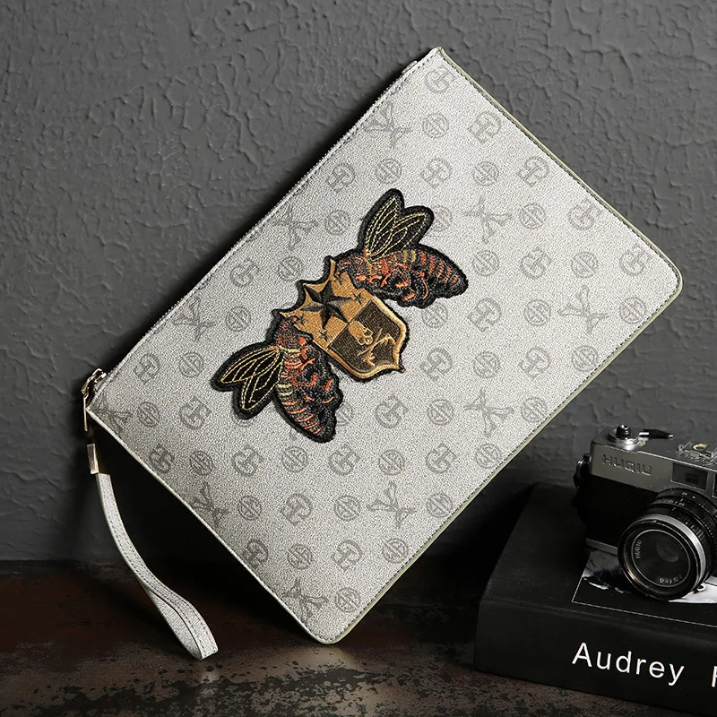 

Korean version of men's handbag fashion printing handbag youth network celebrity envelope bag