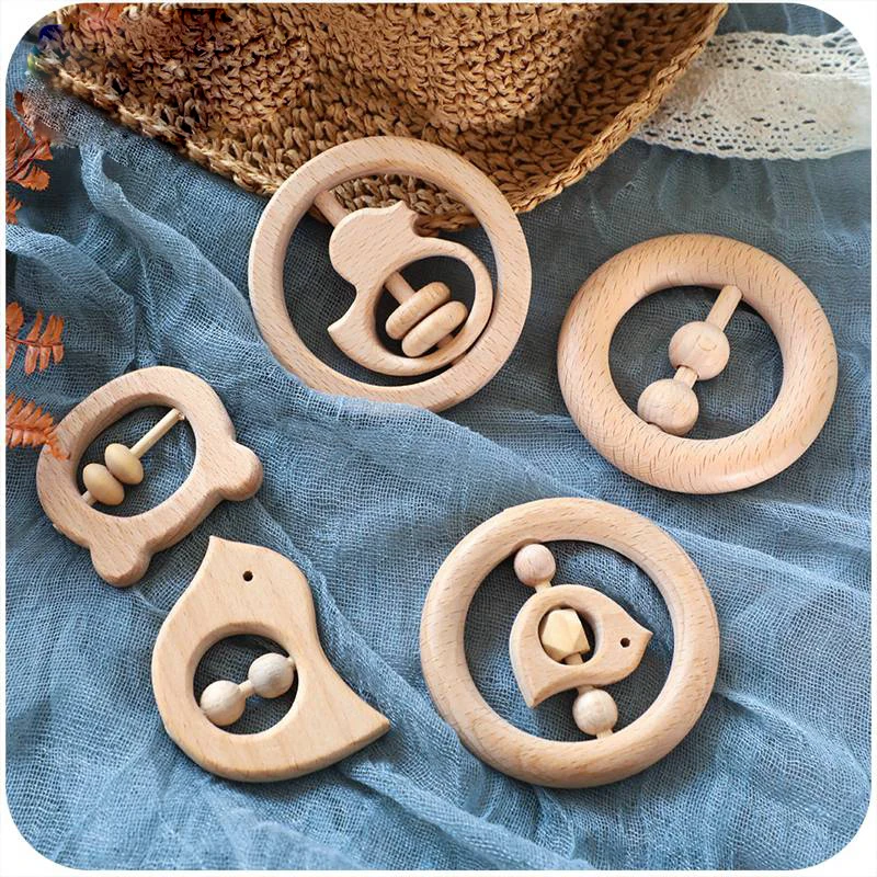 

1pc Baby Toys Wood Teether Bell Rattles Beech Wooden Dog Car Moon Shape Cartoon Wooden Rattles Handle Children Product Gift Toy