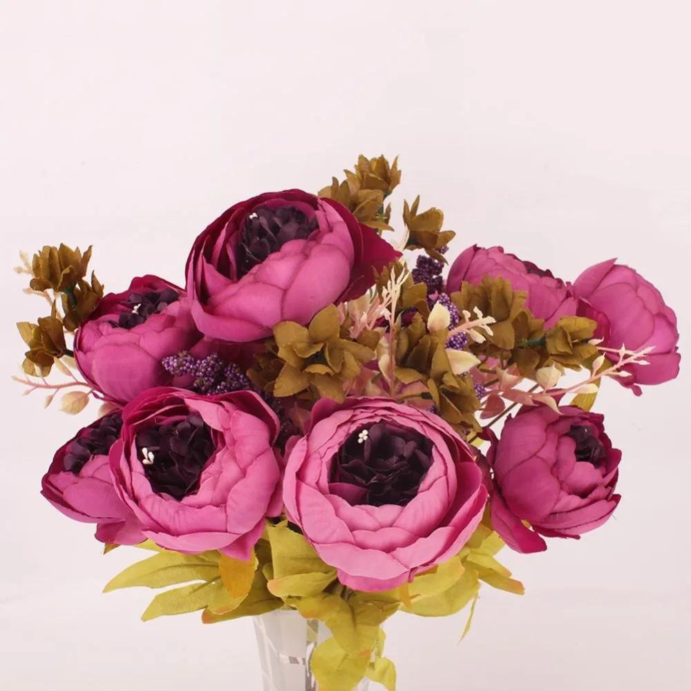 Dining room table decorated false flowers core peony peony flower shape