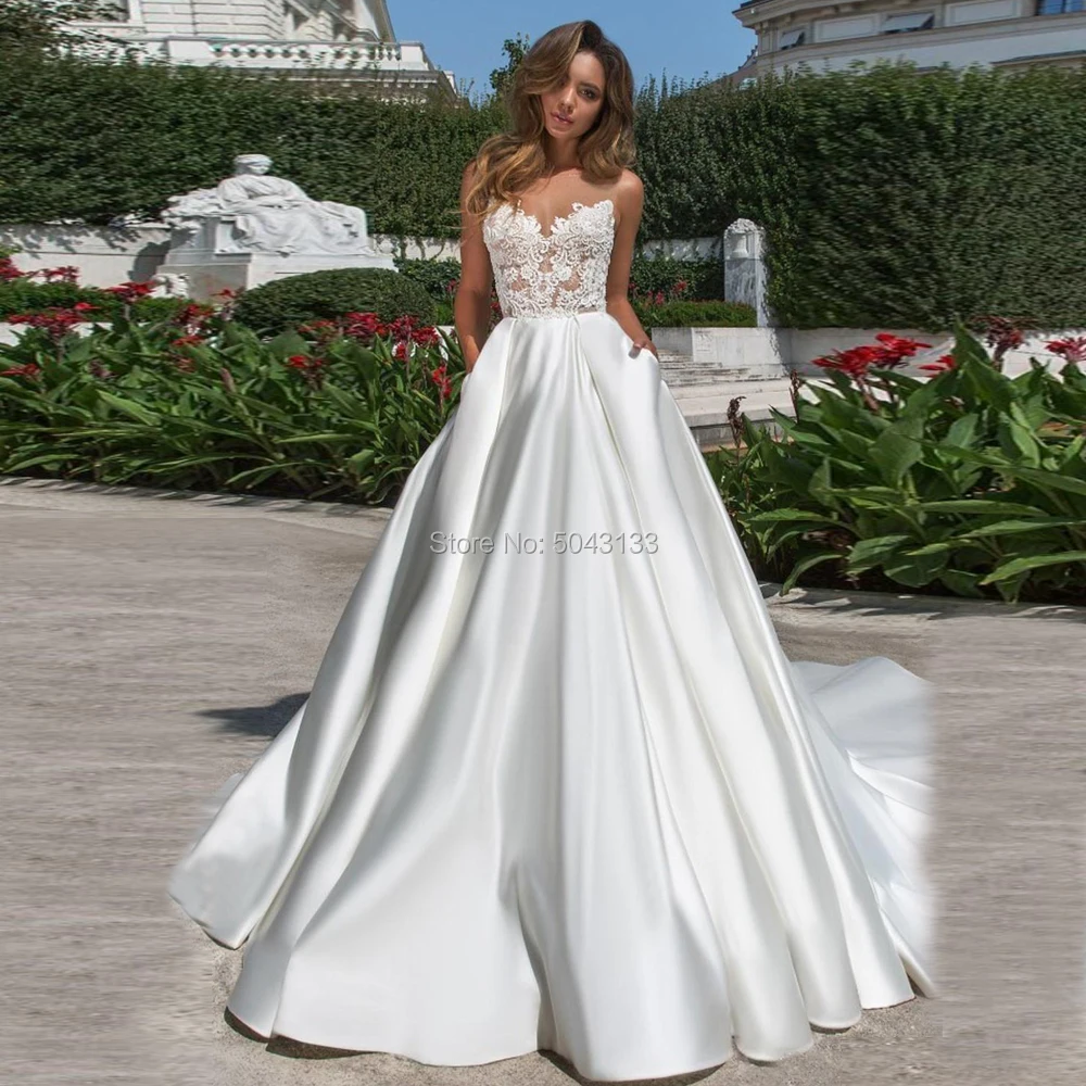 

2020 Newest Designed A Line Satin Wedding Dresses Modest Lace Appliques Sheer Neck V Cut Backless Bridal Gown With Pockets Long