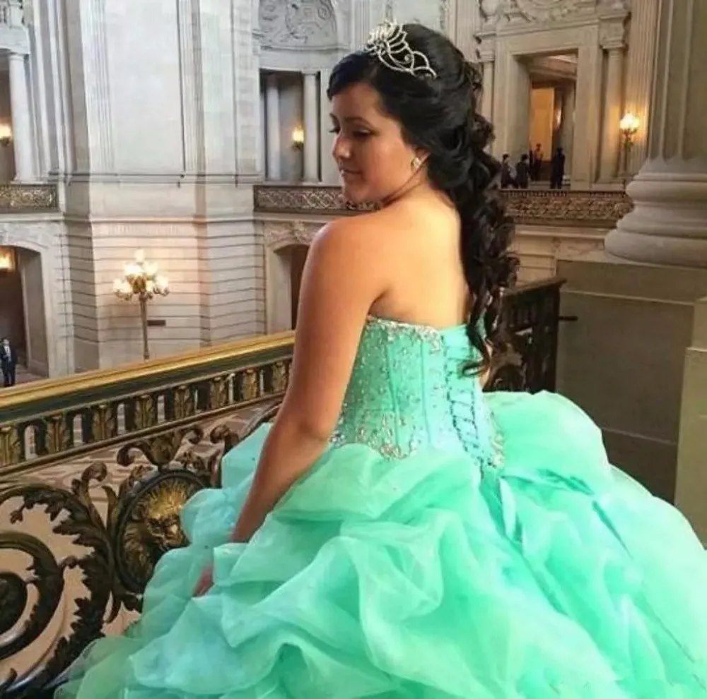 2017-mint-green-quinceanera-ball-gown-dresses-sweetheart-crystal-beaded-puffy-organza-ruffles-tiered-long-sweet-16-party-prom-evening-gowns.webp (1)_