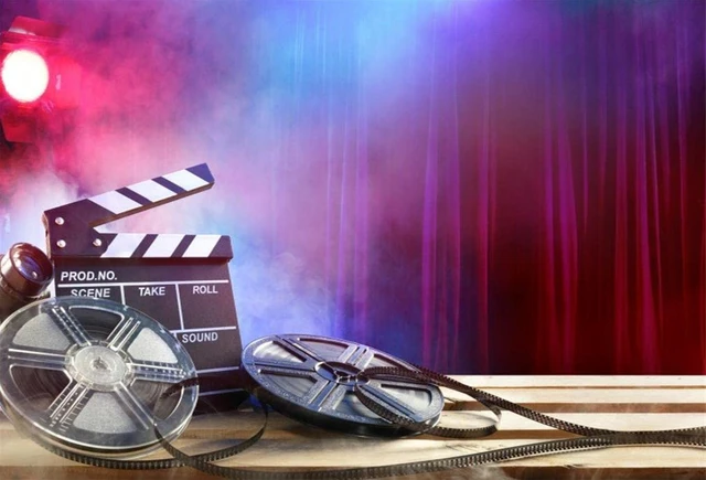 Cinema concept of vintage film reels, clapperboard and projector