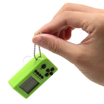 

10pcs Kids Gift Tetris Mini Keychain Game Console Handheld Game Player capsule toy twisted egg Built-in 26 Games
