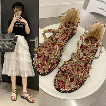 

Roman sandals female 2020 summer new wild fashion fairy style student rivet flat shoes mother shoes national style women's shoes