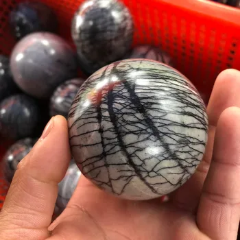 

Natural crystal fossils are handmade into crystal quartz spheres